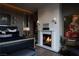 View of the main bedroom featuring a fireplace, decor, and warm lighting at 41 Crested Cloud Way, Las Vegas, NV 89135