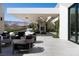 Outdoor patio featuring modern furniture, desert landscaping and mountain views beyond the backyard at 41 Crested Cloud Way, Las Vegas, NV 89135