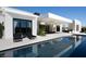 Luxurious pool with stylish lounge chairs reflecting the modern architecture of the home at 41 Crested Cloud Way, Las Vegas, NV 89135