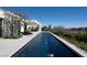 Inviting pool area with multiple water features surrounded by lush landscaping and modern amenities at 41 Crested Cloud Way, Las Vegas, NV 89135