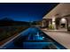 Picturesque pool area with a modern pool, integrated spa, and ambient lighting, creating a serene outdoor oasis at 41 Crested Cloud Way, Las Vegas, NV 89135