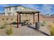 Community area features a shaded gazebo with picnic table and barbeque at 4115 Spring Storm Ave, North Las Vegas, NV 89081