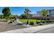 Green community park with walking path, bushes and trees offers serene outdoor living at 4115 Spring Storm Ave, North Las Vegas, NV 89081