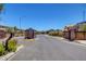 Gated community entrance showcasing secure access and landscaped surroundings at 4115 Spring Storm Ave, North Las Vegas, NV 89081