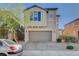 A charming two-story home with a two-car garage and a beautifully paved driveway at 4115 Spring Storm Ave, North Las Vegas, NV 89081