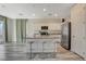 Bright and open kitchen with a center island, stainless steel appliances, and modern finishes at 4115 Spring Storm Ave, North Las Vegas, NV 89081