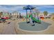 Community playground area with colorful jungle gym, slide and soft ground covering at 4115 Spring Storm Ave, North Las Vegas, NV 89081