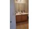 Bathroom with a double-mirrored vanity and tile flooring at 4555 Sahara Ave # 252, Las Vegas, NV 89104