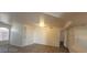 Bright living room featuring sleek floors, slider door, and vaulted ceiling at 4555 Sahara Ave # 252, Las Vegas, NV 89104