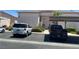 Assigned covered parking in community showing mature landscaping and parking spaces at 4555 Sahara Ave # 252, Las Vegas, NV 89104