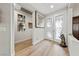 Inviting entryway features decorative glass doors and wood-look tile flooring, creating a warm welcome at 4557 Bersaglio St, Las Vegas, NV 89135