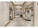 Elegant hallway with arched doorways, patterned carpet, and architectural details at 4557 Bersaglio St, Las Vegas, NV 89135