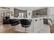 Kitchen featuring quartz countertops, a breakfast bar with seating, and stainless steel appliances at 4557 Bersaglio St, Las Vegas, NV 89135