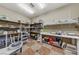 This pottery room has storage shelves, a wedging table, and plenty of room to move around when creating pottery at 4557 Bersaglio St, Las Vegas, NV 89135