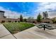 Community park featuring a green lawn, desert landscaping, and a picnic table at 4640 Flower Moon Ave # 102, North Las Vegas, NV 89084