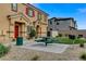 Inviting home exterior with a picnic table, green space and desert landscaping at 4640 Flower Moon Ave # 102, North Las Vegas, NV 89084