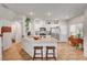 Well-lit kitchen with stainless steel appliances and a breakfast bar, perfect for casual dining at 4640 Flower Moon Ave # 102, North Las Vegas, NV 89084