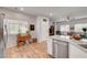 Well-lit kitchen adjacent to the living area showcases modern appliances and bright decor at 4640 Flower Moon Ave # 102, North Las Vegas, NV 89084