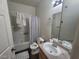 Bathroom has shower-tub combo, single sink vanity, and neutral decor at 4730 E Craig Rd # 1106, Las Vegas, NV 89115