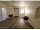 Spacious living room has fireplace, sliding glass door, and hardwood floors at 4730 E Craig Rd # 1106, Las Vegas, NV 89115