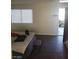 Bright bedroom features wood floors, a large window, and a door to the outside at 4770 Topaz St # 79, Las Vegas, NV 89121