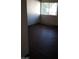 Bedroom featuring dark vinyl flooring, neutral walls, and a window at 4770 Topaz St # 79, Las Vegas, NV 89121