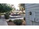 A view of a condo's exterior showcasing ample parking space and lush green trees at 4770 Topaz St # 79, Las Vegas, NV 89121