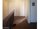 Upstairs hallway with brown floors, a closet, and white trim at 4770 Topaz St # 79, Las Vegas, NV 89121