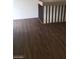 Hallway flooring has luxury vinyl plank. Brown railing on the staircase at 4770 Topaz St # 79, Las Vegas, NV 89121