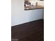 Kitchen area with white walls, dark vinyl flooring, laminate countertop, and a bar-height counter at 4770 Topaz St # 79, Las Vegas, NV 89121