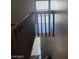 View of the staircase with wood railing at 4770 Topaz St # 79, Las Vegas, NV 89121