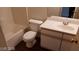 Bright bathroom featuring a toilet, bathtub and vanity with sink and mirror at 5750 E Hacienda Ave # 202, Las Vegas, NV 89122