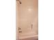 Bathroom featuring shower and tub combination with white tile at 5750 E Hacienda Ave # 202, Las Vegas, NV 89122