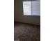 Comfortable bedroom with neutral carpet and window providing natural light at 5750 E Hacienda Ave # 202, Las Vegas, NV 89122