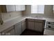 Close up of the kitchen with white cabinets, neutral countertops, gas range and a stainless steel sink at 5750 E Hacienda Ave # 202, Las Vegas, NV 89122