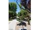 An exterior walkway lined with lush greenery and desert foliage at 5750 E Hacienda Ave # 202, Las Vegas, NV 89122