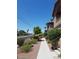 A charming exterior walkway with a manicured landscape and desert plants at 5750 E Hacienda Ave # 202, Las Vegas, NV 89122