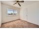 Bedroom featuring a ceiling fan, a window, and neutral carpet at 6120 Cairo Cir, Las Vegas, NV 89107