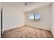 A well lit carpeted bedroom with a window at 6120 Cairo Cir, Las Vegas, NV 89107