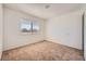 Bedroom featuring neutral carpet, window, and closet at 6120 Cairo Cir, Las Vegas, NV 89107