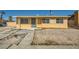 Single story home with a rock yard and minimal landscaping at 6120 Cairo Cir, Las Vegas, NV 89107