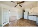 Bright kitchen with white appliances, tile floors, double doors, ceiling fan, and view into other rooms at 6120 Cairo Cir, Las Vegas, NV 89107