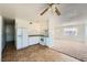 Bright kitchen with tile floors, white cabinets and appliances, view into other rooms at 6120 Cairo Cir, Las Vegas, NV 89107