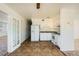 Well-lit kitchen with tile floors, white cabinets and appliances, and view into other rooms at 6120 Cairo Cir, Las Vegas, NV 89107