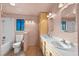 Bathroom featuring a dual sink vanity and shower-tub combo at 6217 Sadler Dr, Las Vegas, NV 89130