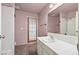 Bathroom with tiled floors, a sink and a shower-tub, creating a functional and comfortable space at 6217 Sadler Dr, Las Vegas, NV 89130