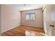 Bedroom featuring laminate floors and a bright window, creating a cheerful and comfortable space at 6217 Sadler Dr, Las Vegas, NV 89130