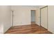 Bedroom with laminate floors, neutral walls, and a closet, ideal for a minimalist and comfortable living space at 6217 Sadler Dr, Las Vegas, NV 89130