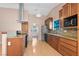 A spacious kitchen showcases stainless steel appliances, granite countertops and wood flooring at 6217 Sadler Dr, Las Vegas, NV 89130