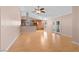 Bright living area with laminate floors connecting to the open kitchen area at 6217 Sadler Dr, Las Vegas, NV 89130